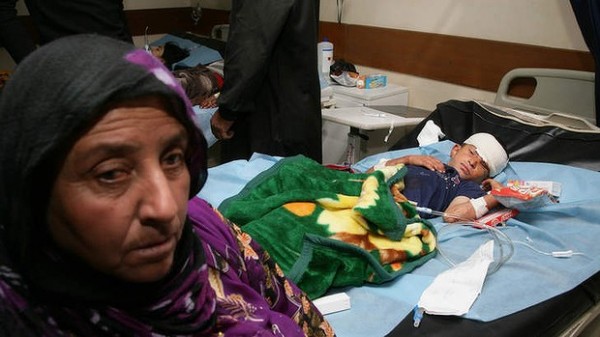 131006-iraq-victim-injured-by-suicide-bombers