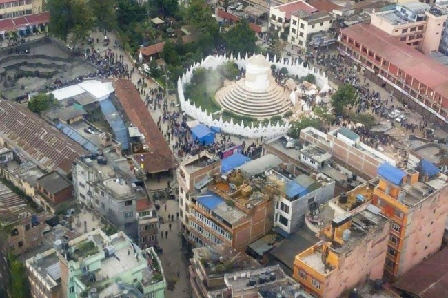 This  aerial photo provided by Shreejan Bhandari, shows the historical Dharahara Tower, a city landmark, destroyed by Saturday's earthquake in Kathmandu, Nepal, Monday, April 27, 2015. A strong magnitude earthquake shook Nepals capital and the densely populated Kathmandu valley on Saturday devastating the region and leaving tens of thousands shell-shocked and sleeping in streets. (Shreejan Bhandari via AP) MANDATORY CREDIT