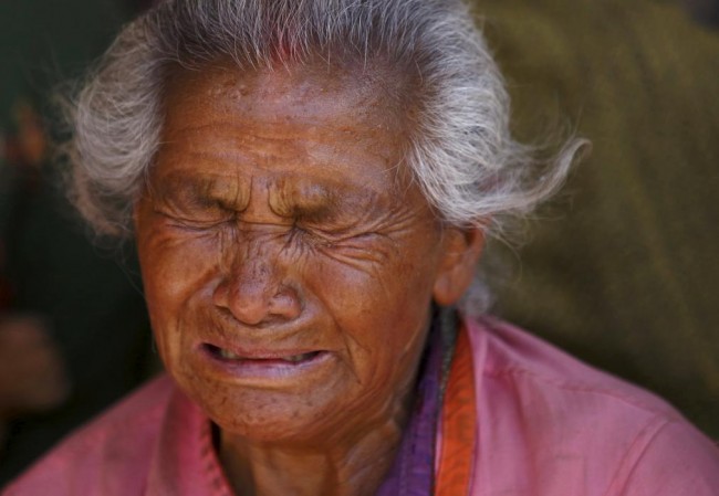 A woman mourns her granddaughter, who died in Saturday's earthquake, in Bhaktapur, Nepal April 27, 2015. REUTERS/Navesh Chitrakar