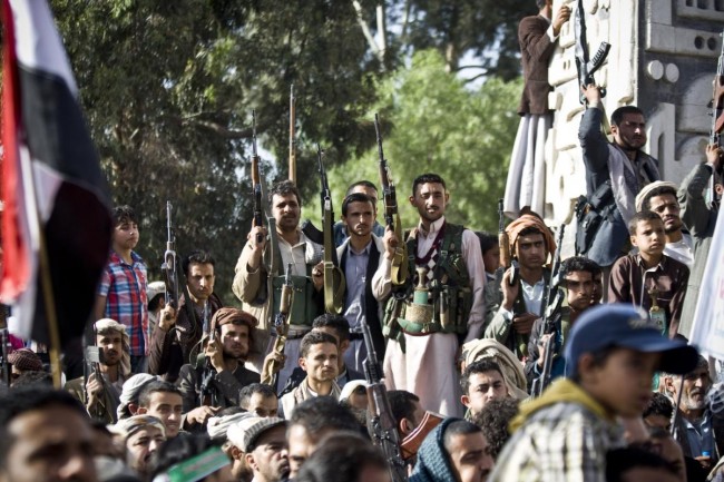 Shiite rebels, known as Houthis, hold up their weapons during a demonstration against an arms embargo imposed by the U.N. Security Council on Houthi leaders, in Sanaa, Yemen, Thursday, April 16, 2015. Al-Qaidas branch in Yemen seized Thursday control of a major airport and sea port and oil terminal in southern Yemen, consolidating their hold of the countrys largest province amid wider chaos that is pitting Shiite rebels against forces loyal to the countrys exiled president and a Saudi-led air campaign.(AP Photo/Hani Mohammed)