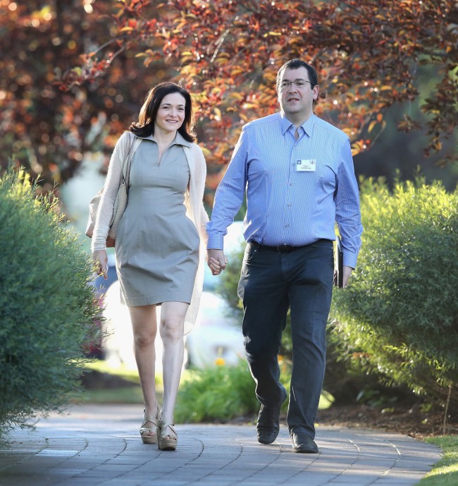 SUN VALLEY, ID - JULY 09:  Sheryl Sandberg, chief operating officer (COO) of Facebook, and her husband David Goldberg, CEO of SurveyMonkey, attend the Allen & Company Sun Valley Conference on July 9, 2014 in Sun Valley, Idaho. Many of the worlds wealthiest and most powerful businessmen from media, finance, and technology attend the annual week-long conference which is in its 32nd year.  (Photo by Scott Olson/Getty Images)