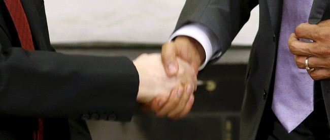 U.S. President Barack Obama (R) shakes hands with Vietnam's Communist Party General Secretary Nguyen Phu Trong following their meeting in the Oval Office at the White House in Washington July 7, 2015. Trong is Vietnam's first party general secretary to visit the U.S., as Hanoi has strengthened its military relationship with former foe Washington since a territorial dispute with Beijing in the South China Sea has heated up in the past couple of years. REUTERS/Jonathan Ernst