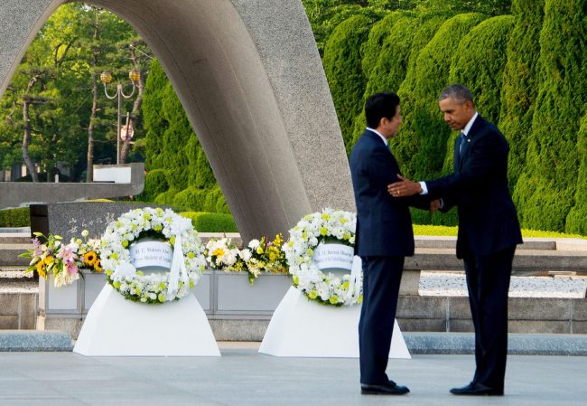 US President Barack Obama (R) and Japanese Prime Minister Shinzo Abe shake hands after laying wreaths at the Hiroshima Peace Memorial Park in Hiroshima on May 27, 2016. Obama on May 27 paid moving tribute to victims of the world's first nuclear attack. / AFP / JIM WATSON (Photo credit should read JIM WATSON/AFP/Getty Images)