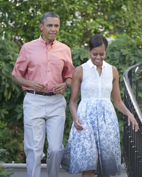 WASHINGTON, DC - JULY 04: U.S. President Barack Obama and first lady Michelle Obama walk down the South Portico stairs to work the rope line as they host a Fourth of July barbecue for military heroes and their families on the South Lawn of the White House on July 4, 2013 in Washington, DC. The president and first lady are hosting members of the military and their families in commemoration of Independence Day. (Photo by Ron Sachs-Pool/Getty Images)